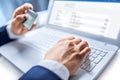 Man hands typing on the keyboard of laptop holding credit card, Royalty Free Stock Photo