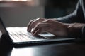 Man hands typing on laptop computer keyboard Royalty Free Stock Photo