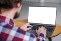 Man hands typing on laptop keyboard with white blank screen - mockup image Royalty Free Stock Photo