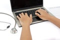 Man hands use laptop to fills health insurance claim Royalty Free Stock Photo