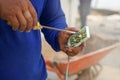 Man hands using screwdriver repair power socket on construction site Royalty Free Stock Photo