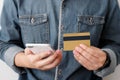 Man hands using smart phone and holding credit card, shopping on Royalty Free Stock Photo