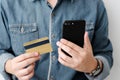 Man hands using smart phone and holding credit card, shopping on Royalty Free Stock Photo