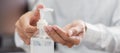 Man hands using wash hand alcohol gel or sanitizer bottle dispenser, against Novel coronavirus or Corona Virus Disease Covid-19 Royalty Free Stock Photo