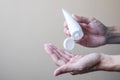 Man hands using wash hand alcohol gel or sanitizer bottle dispenser, against Novel coronavirus or Corona Virus Disease Covid-19
