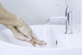 Man hands washing or cleansing with soap foam under tap water at lavatory. Concept good hygine and coronavirus protection