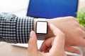 Man hands Watch with isolated screen and laptop Royalty Free Stock Photo