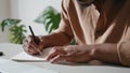 Man hands writing notebook closeup. Unrecognizable guy making notes at home Royalty Free Stock Photo