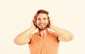 Man handsome bearded guy listening music headphones white background. Audiovisual spectacular. Melody put over various