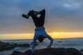 Man Handstand Ocean Rocks Silhouetted Royalty Free Stock Photo