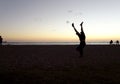 Man Handstanding on beach at sunset