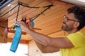 man hanging clothes inside his motorhome Royalty Free Stock Photo