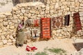 A man is hanging colorful carpet for sale, Jordan