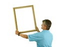 Man hanging or holding blank picture frame on wall Royalty Free Stock Photo