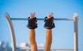 Man hanging upside down on the horizontal bar in anti gravity or inversion boots Royalty Free Stock Photo