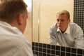 Man with hangover in a bathroom Royalty Free Stock Photo