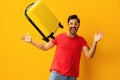 Man happy flight baggage vacation traveler journey background travel yellow trip suitcase studio Royalty Free Stock Photo