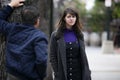 Man Harassing Woman on the Street or a Criminal Stalking Victim Royalty Free Stock Photo