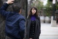 Man Harassing Woman on the Street or a Criminal Stalking Victim Royalty Free Stock Photo