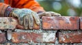 A man in a hard hat and gloves is holding up bricks, AI Royalty Free Stock Photo