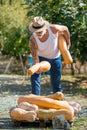 Man harvests big pumpkin from patch. Royalty Free Stock Photo