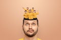 The man has little people dancing in his head. The concept of cheerful thoughts, euphoria, the brain rejoices, endorphins, Royalty Free Stock Photo