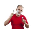 Man has a shave- with the razor and a small brush Royalty Free Stock Photo