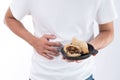 A man has a stomachache after eating delicious zongzirice dumpling on Dragon Boat Festival, Asian traditional food Royalty Free Stock Photo