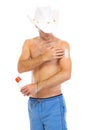 Man in hat applying sun block creme on arm Royalty Free Stock Photo