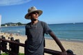 Man in hat on beach, Hainan island, Sanya, China Royalty Free Stock Photo