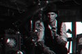 man in a hat and with a cane cosplays a character of a steampunk computer game. Inventor's cyberpunk concept with 3d