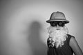 Man in a hat with a false beard Royalty Free Stock Photo