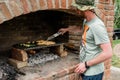 Man preparing barbeque on the grill