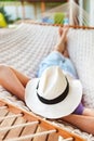 Man in hat in a hammock on a summer day Royalty Free Stock Photo