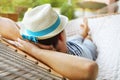 Man in hat in a hammock on a summer day Royalty Free Stock Photo