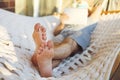 Man in hat in a hammock with tablet computer on a summer day Royalty Free Stock Photo