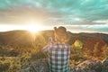 Man in a hat making a selfi at sunset .Guy making a selfi with a smartphone Royalty Free Stock Photo
