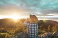 Man in a hat making a selfi at sunset .Guy making a selfi with a smartphone Royalty Free Stock Photo