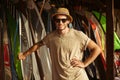 Man in hat and sunglasses standing at the surf shack Royalty Free Stock Photo