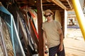 Man in hat and sunglasses standing at the surf shack Royalty Free Stock Photo