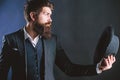 Man with hat. Vintage fashion. Man well groomed bearded gentleman on dark background. Male fashion and menswear. Formal Royalty Free Stock Photo