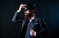 Man with hat. Vintage fashion. Man well groomed bearded gentleman on dark background. Male fashion and menswear. Retro Royalty Free Stock Photo