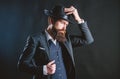 Man with hat. Man well groomed bearded gentleman on dark background. Male fashion and menswear. Retro fashion hat Royalty Free Stock Photo