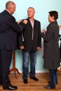 Man having a bespoke suit fitted. Royalty Free Stock Photo