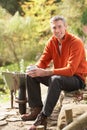 Man Having Break Whilst Working In Garden Royalty Free Stock Photo