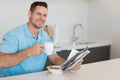 Man having breakfast while holding newspaper Royalty Free Stock Photo