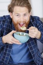 Man having cereal for breakfast alone Royalty Free Stock Photo