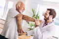 Man having chiropractic arm adjustment. Royalty Free Stock Photo