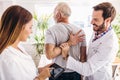 Man having chiropractic arm adjustment. Royalty Free Stock Photo