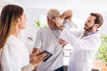 Man having chiropractic arm adjustment. Royalty Free Stock Photo